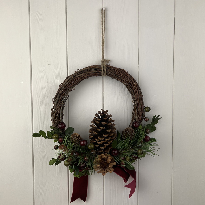 Medium Rattan Pinecone and Berry Wreath with Bow detail page